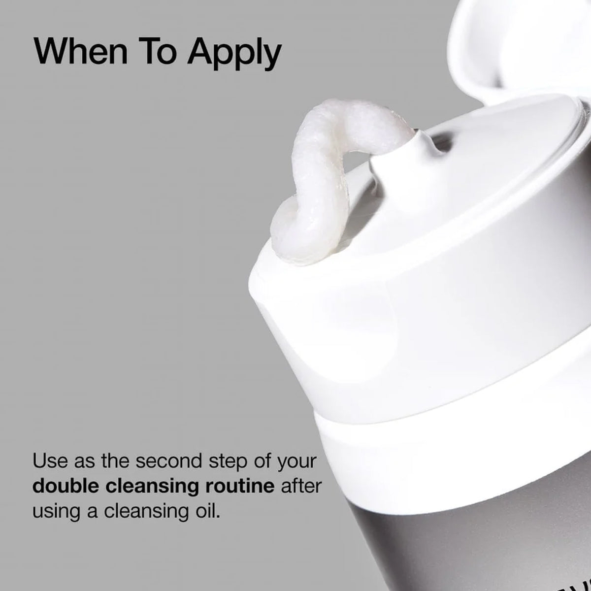 White skincare product with text on a gray background
