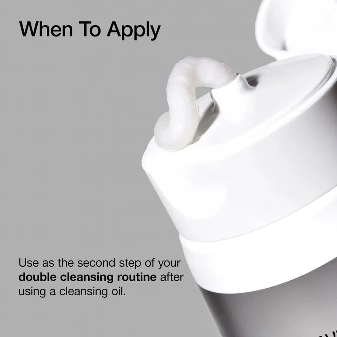 White facial cleansing device with text on a gray background