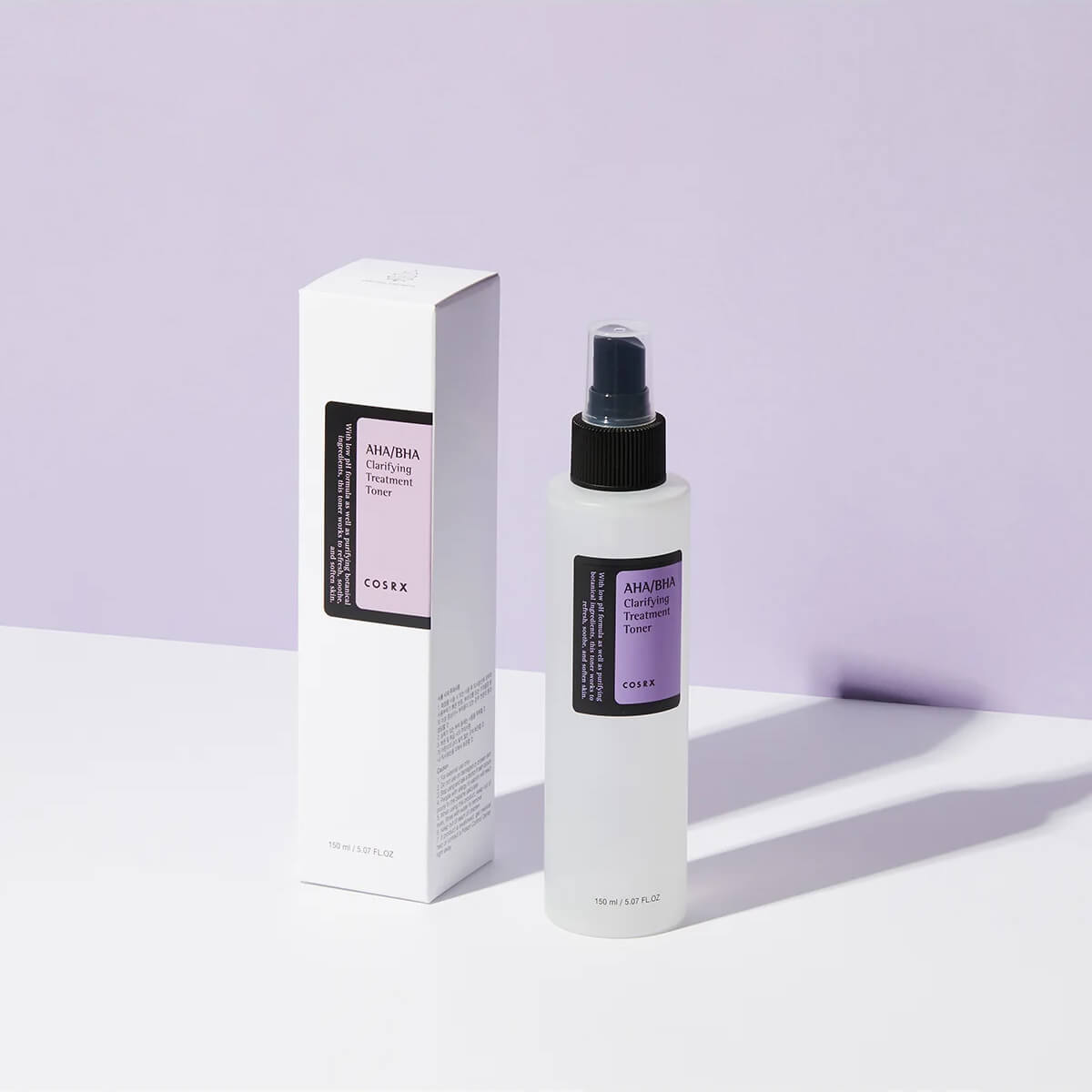Cosrx AHA/BHA Exfoliating Toner bottle and packaging on a light purple background
