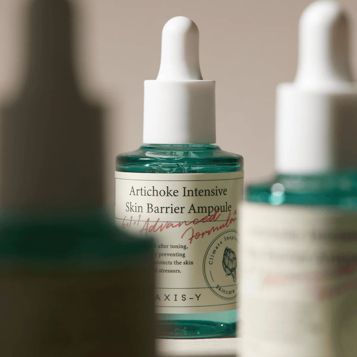 Artichoke Intensive Skin Barrier Ampoule bottle with dropper on a neutral background