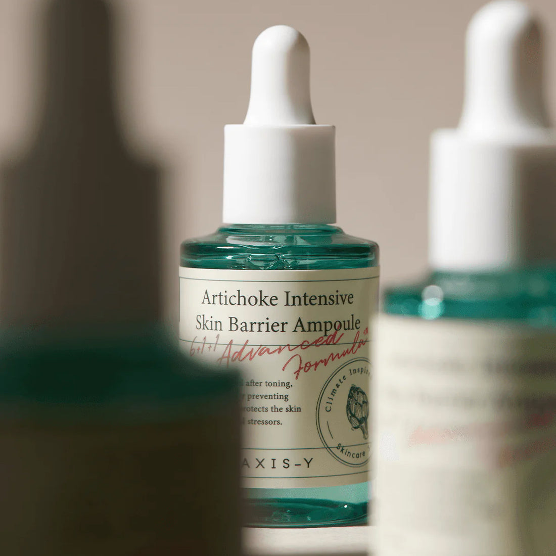 Artichoke Intensive Skin Barrier Ampoule bottle with dropper on a neutral background