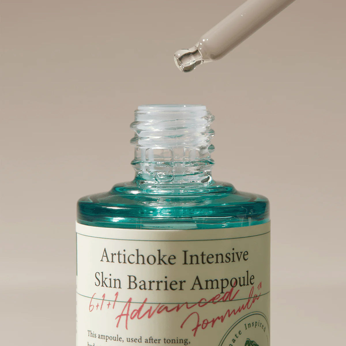 Artichoke Intensive Skin Barrier Ampoule bottle with dropper on beige background