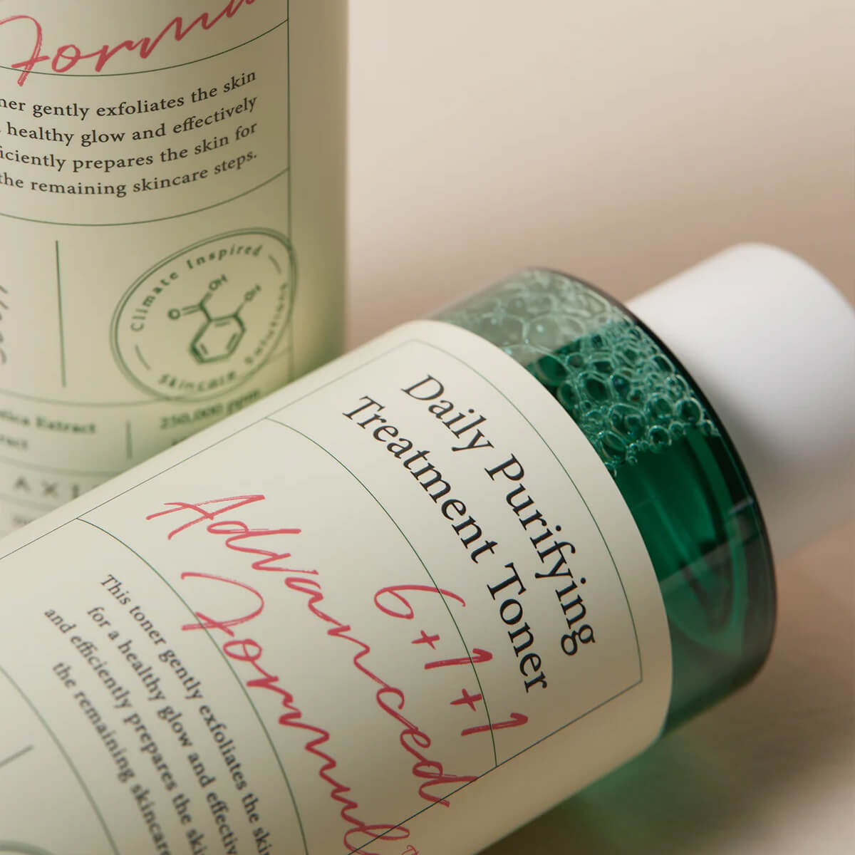 Bottle of Daily Purifying Treatment Toner with green cap and visible label text.