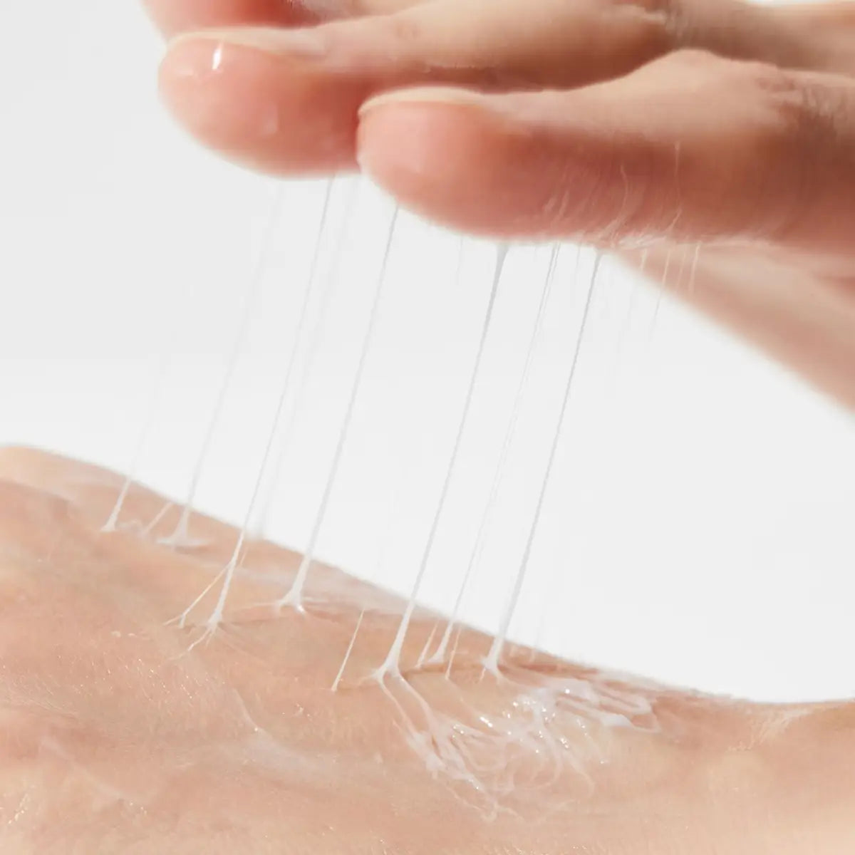 Close-up of a person applying Cosrx Advanced Snail Peptide Eye Cream