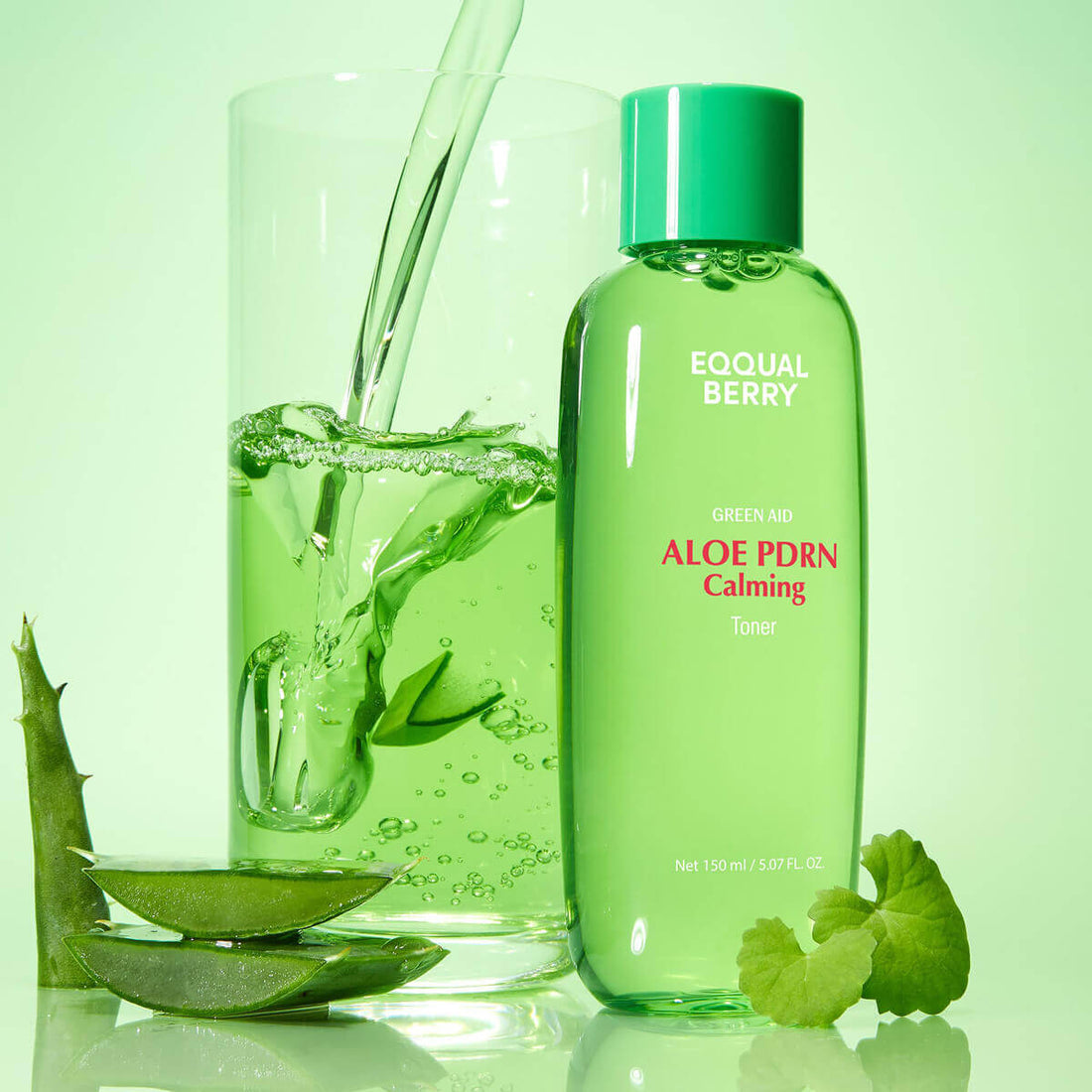 Green bottle of Eqqualberry Aloe PDRN Calming Toner with a glass of green liquid and aloe vera leaves on a green background.