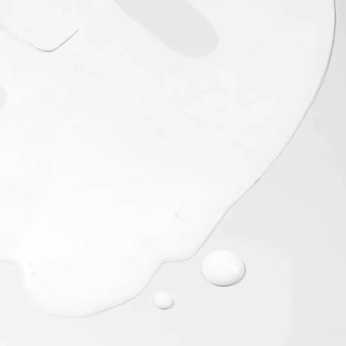 Close-up of a white shirt with buttons on a light gray background