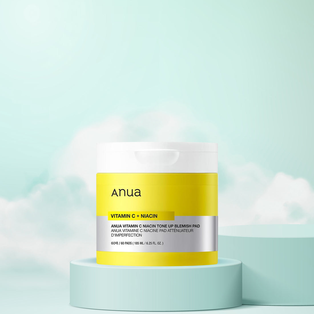 Anua Vitamin C + Niacin skincare product on a light blue background