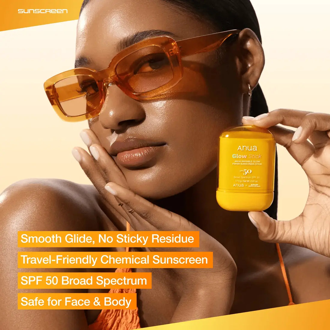 Woman holding a bottle of sunscreen with product features highlighted