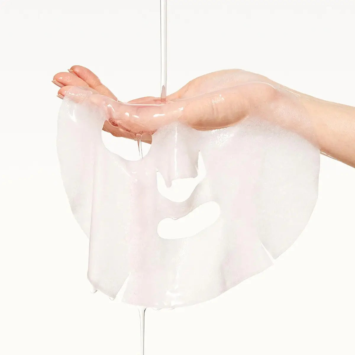 Transparent plastic wrap held by a hand on a white background
