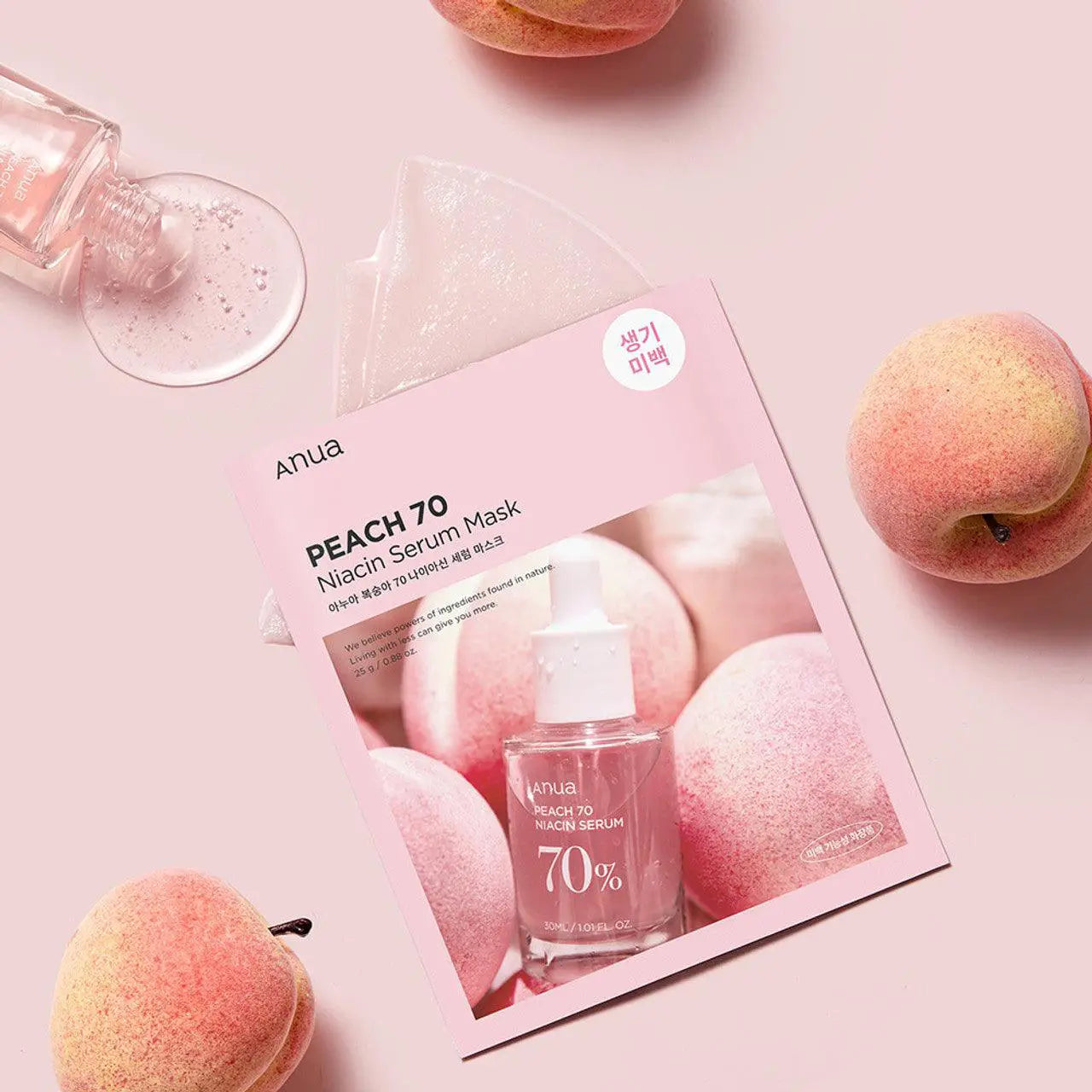 Anua Peach 70 Niacin Serum Mask packaging with peaches on a pink background