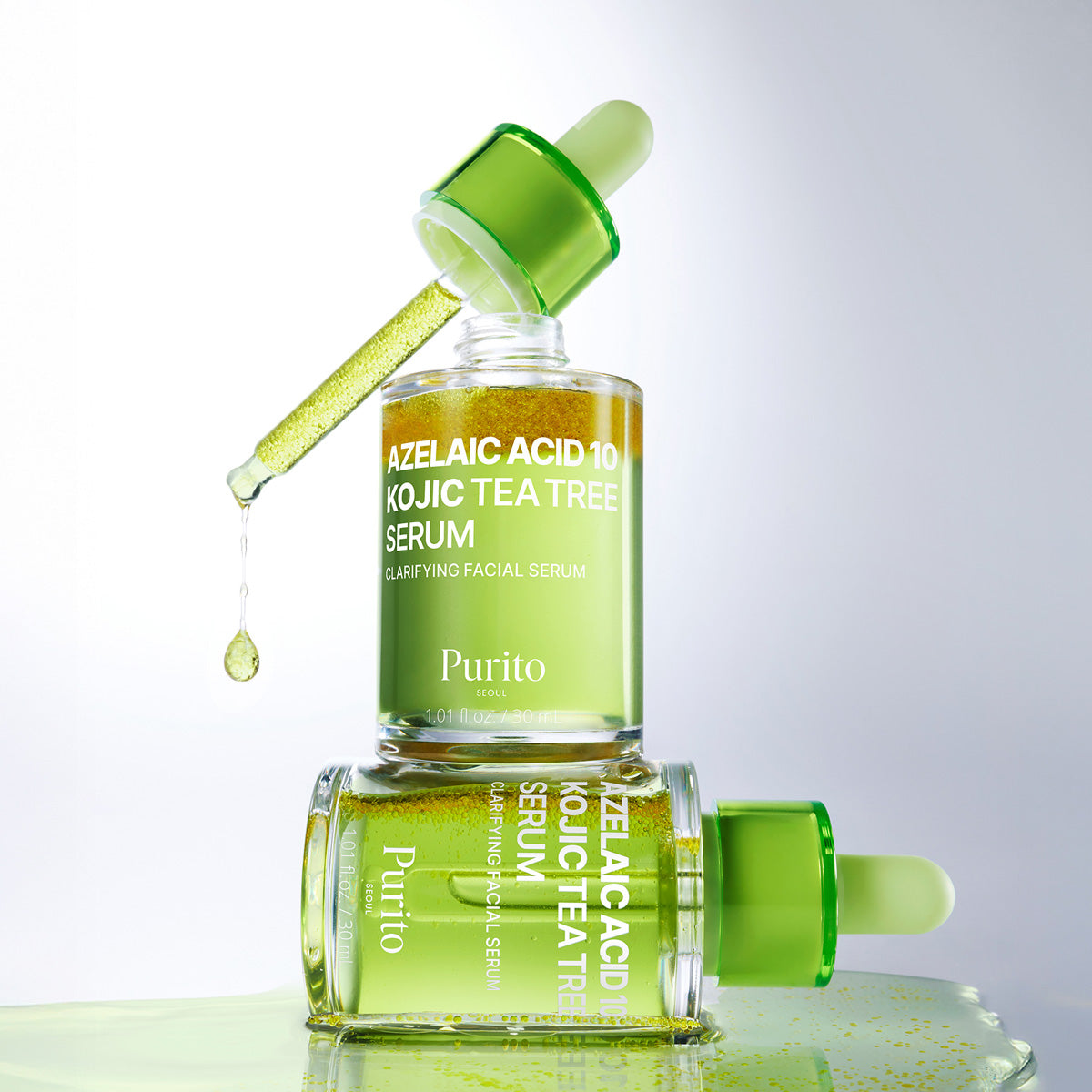 Purito Azelaic Acid 10 Kojic Tea Tree Serum with dropper on a reflective surface.
