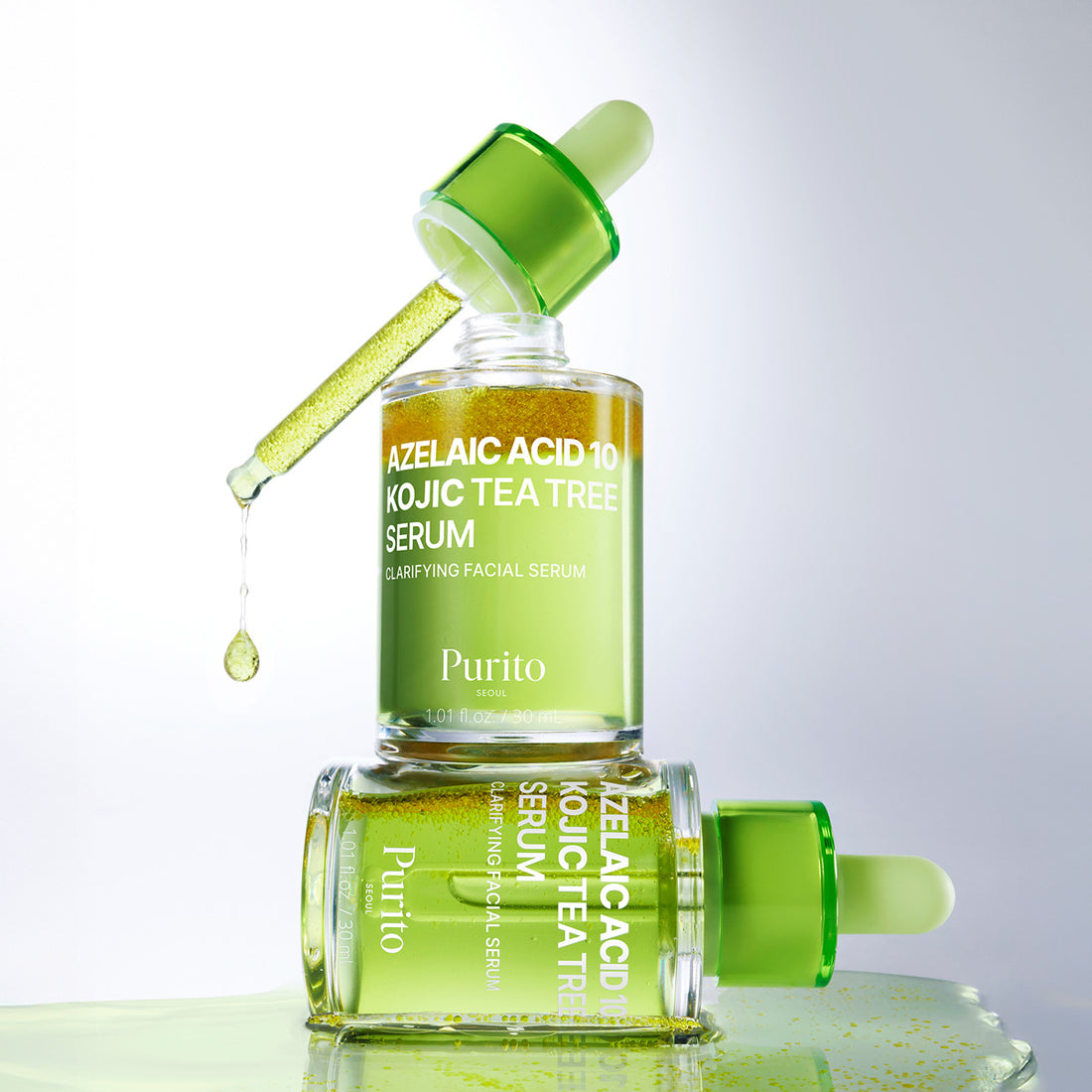 Purito Azelaic Acid 10 Kojic Tea Tree Serum with dropper on a reflective surface.