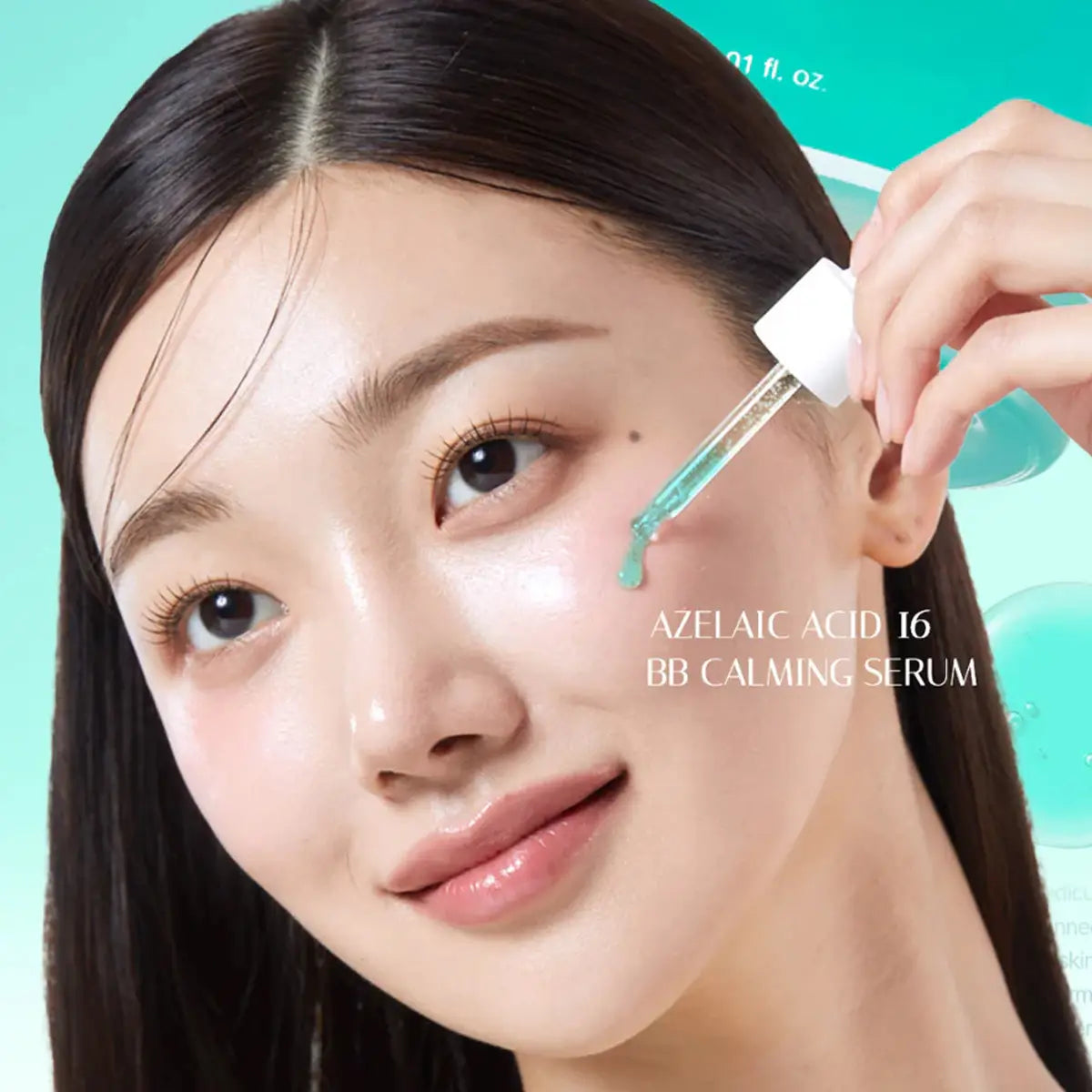 Woman applying azelaic acid 16 BB calming serum to her face with a dropper.