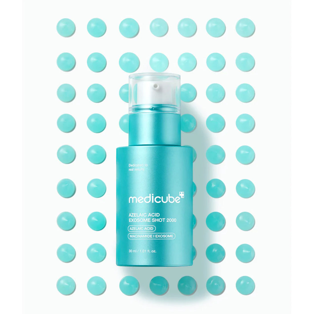 Blue skincare bottle with 'medicube' branding on a white background with blue dots.