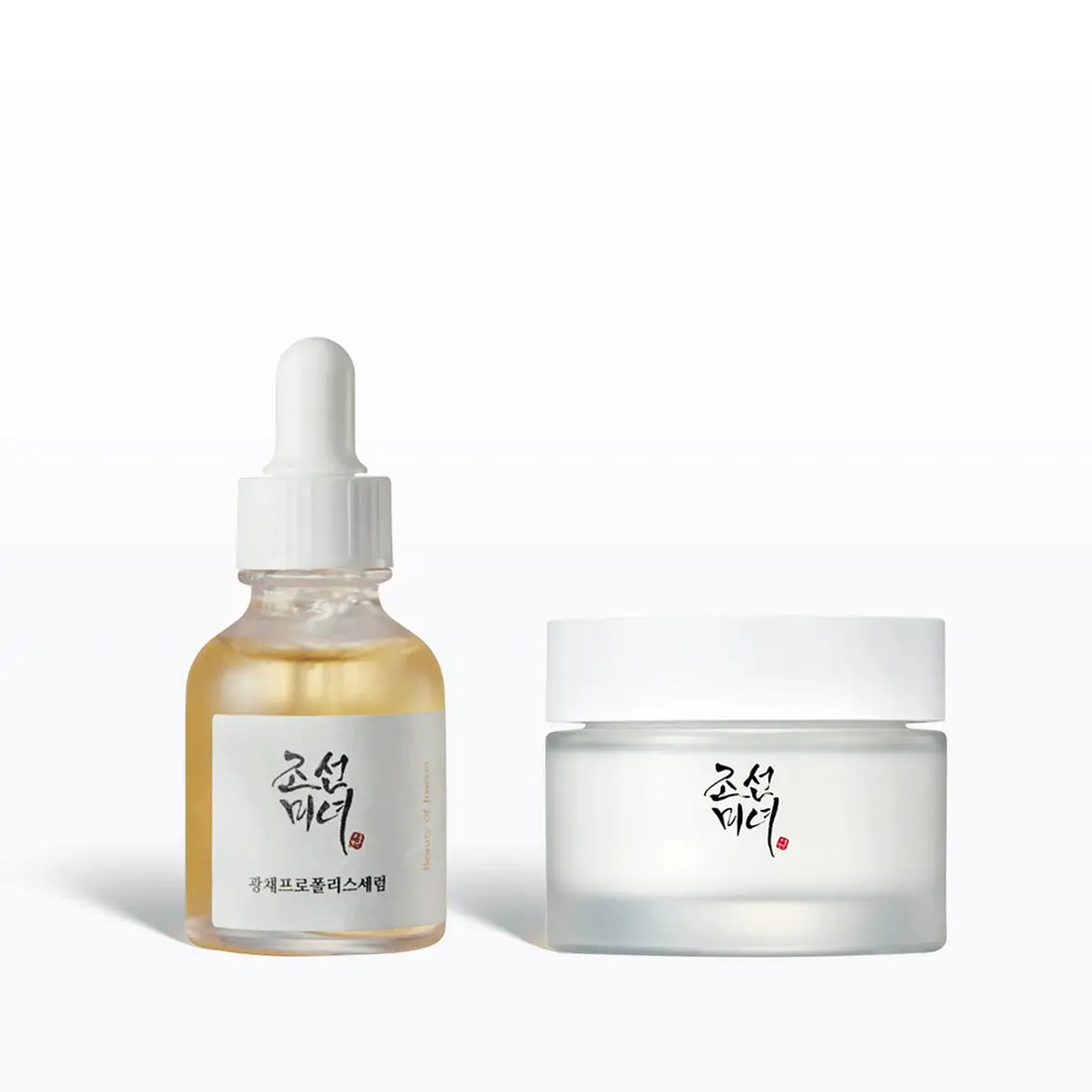 Skincare product set with dropper bottle and jar on a white background