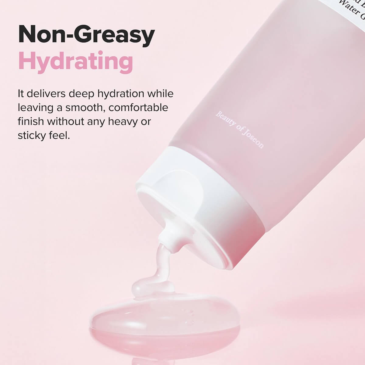 Pink skincare product with white cream being squeezed out on a light pink background, labeled 'Non-Greasy Hydrating'.