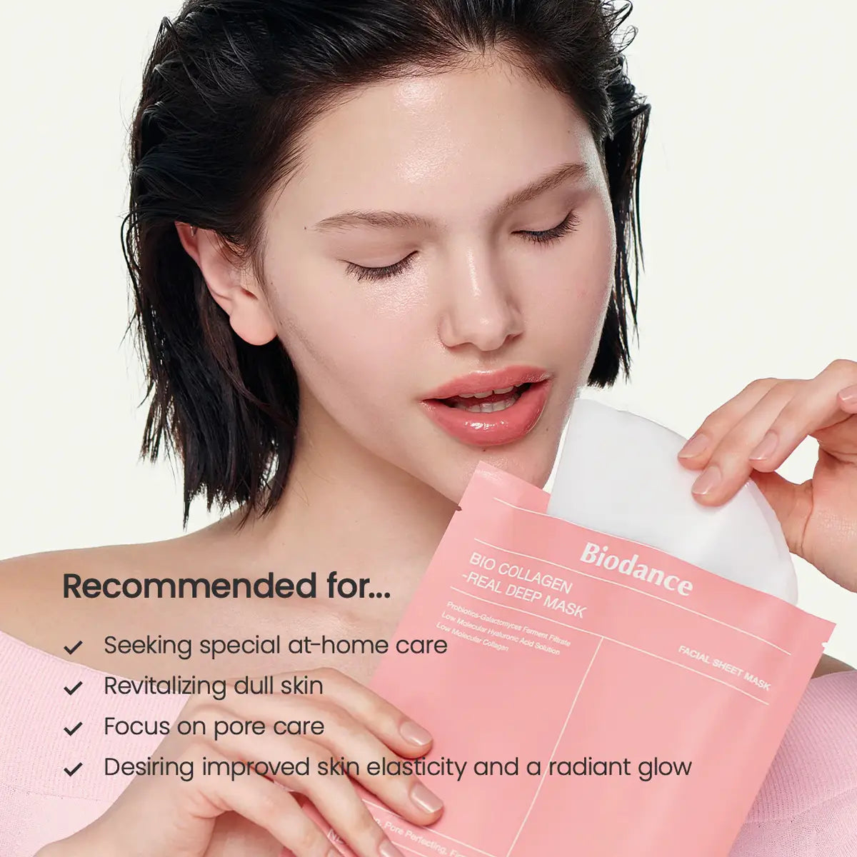 Woman holding a Biodance sheet mask with product details on a white background
