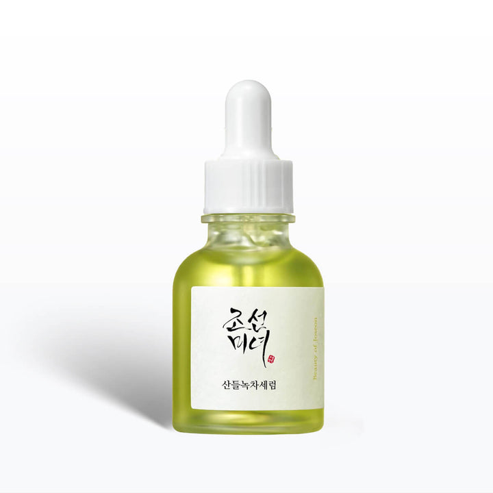Skincare serum bottle with dropper on a white background