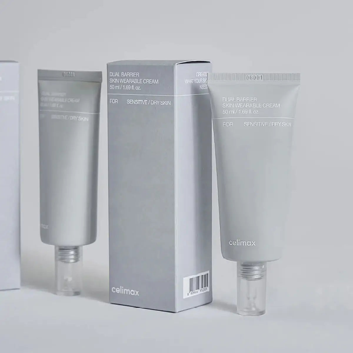 Two tubes and a box of Celimax Dual Barrier Skin Wearable Cream on a light gray background