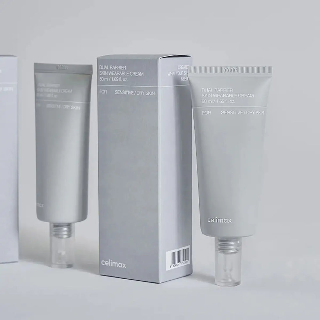 Two tubes and a box of Celimax Dual Barrier Skin Wearable Cream on a light gray background