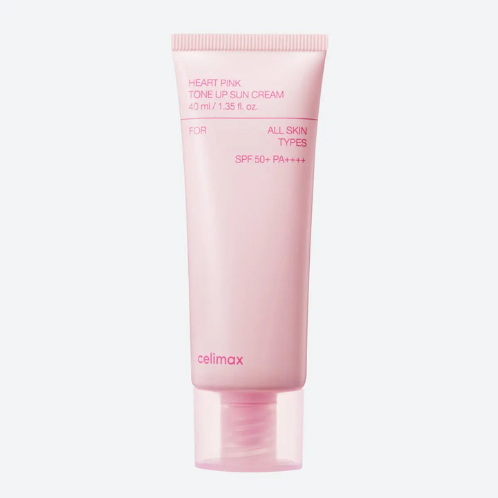 Pink tube of celmax sunscreen cream on a white background