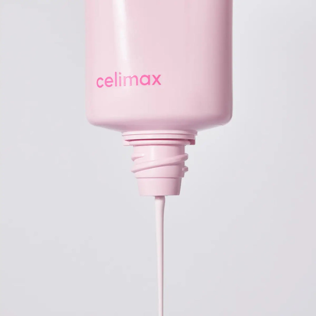 Pink bottle with 'celimax' branding on a light gray background