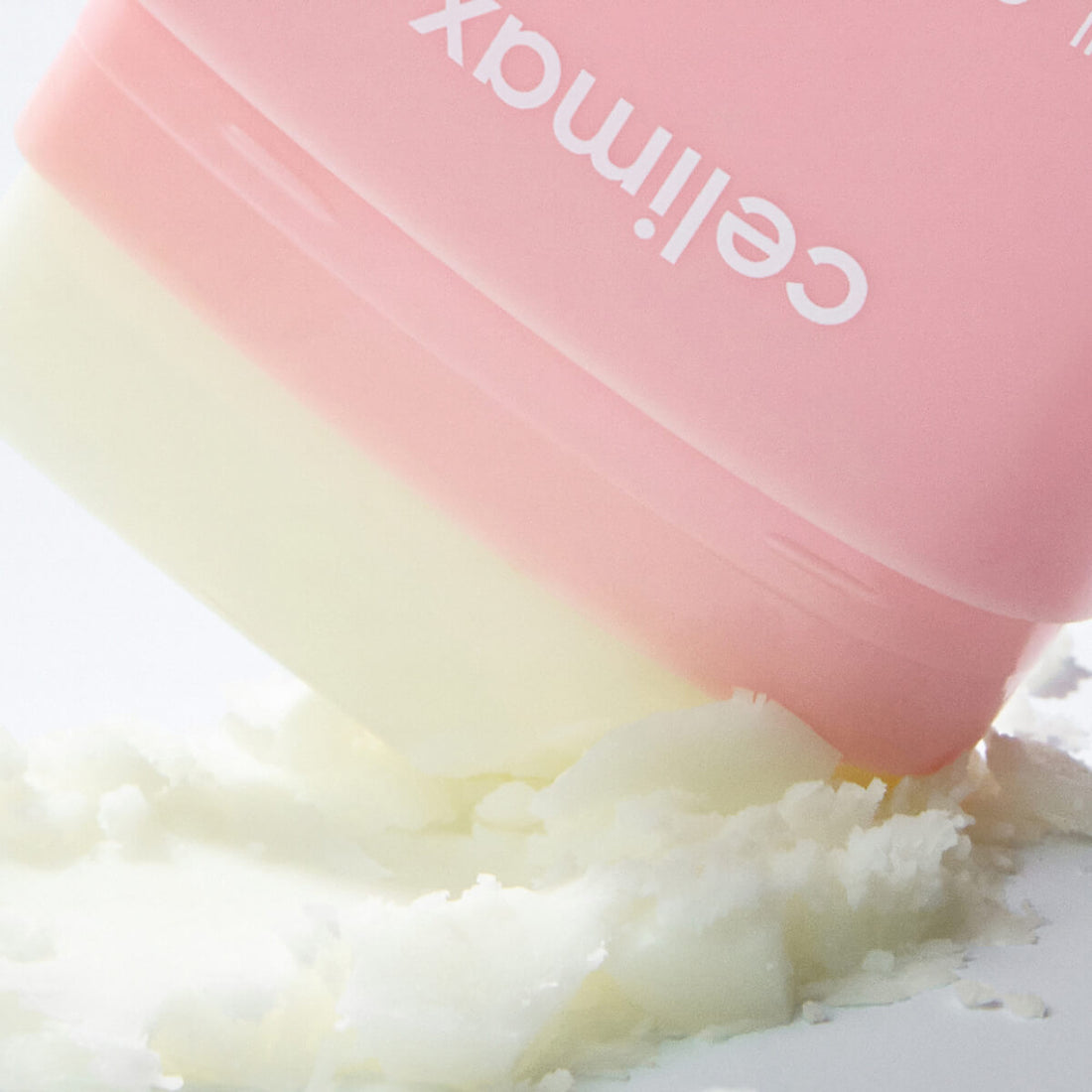 Pink container labeled 'Celimax' with a white powdery substance inside.