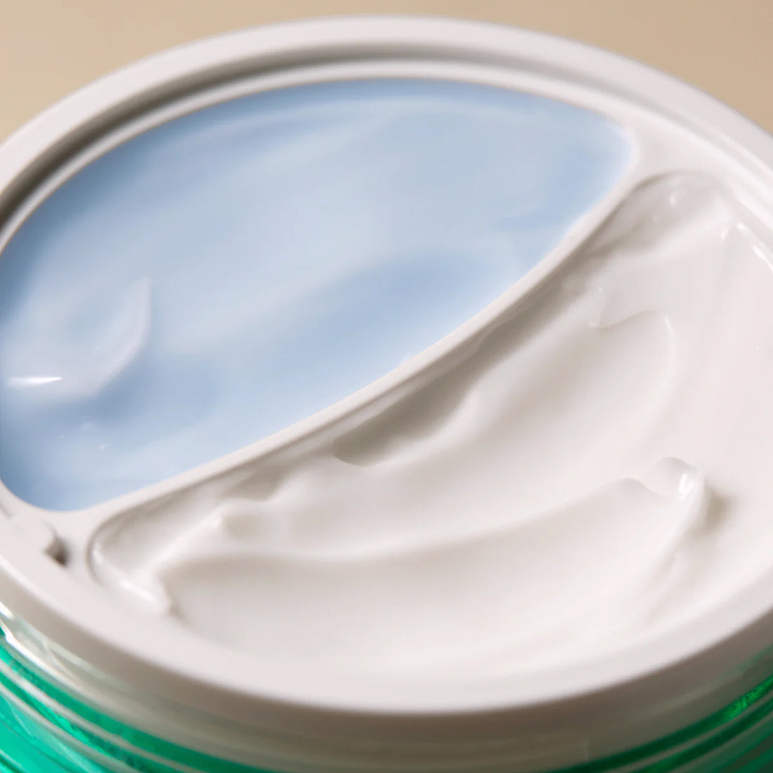 Close-up of a container with a white lid and green base