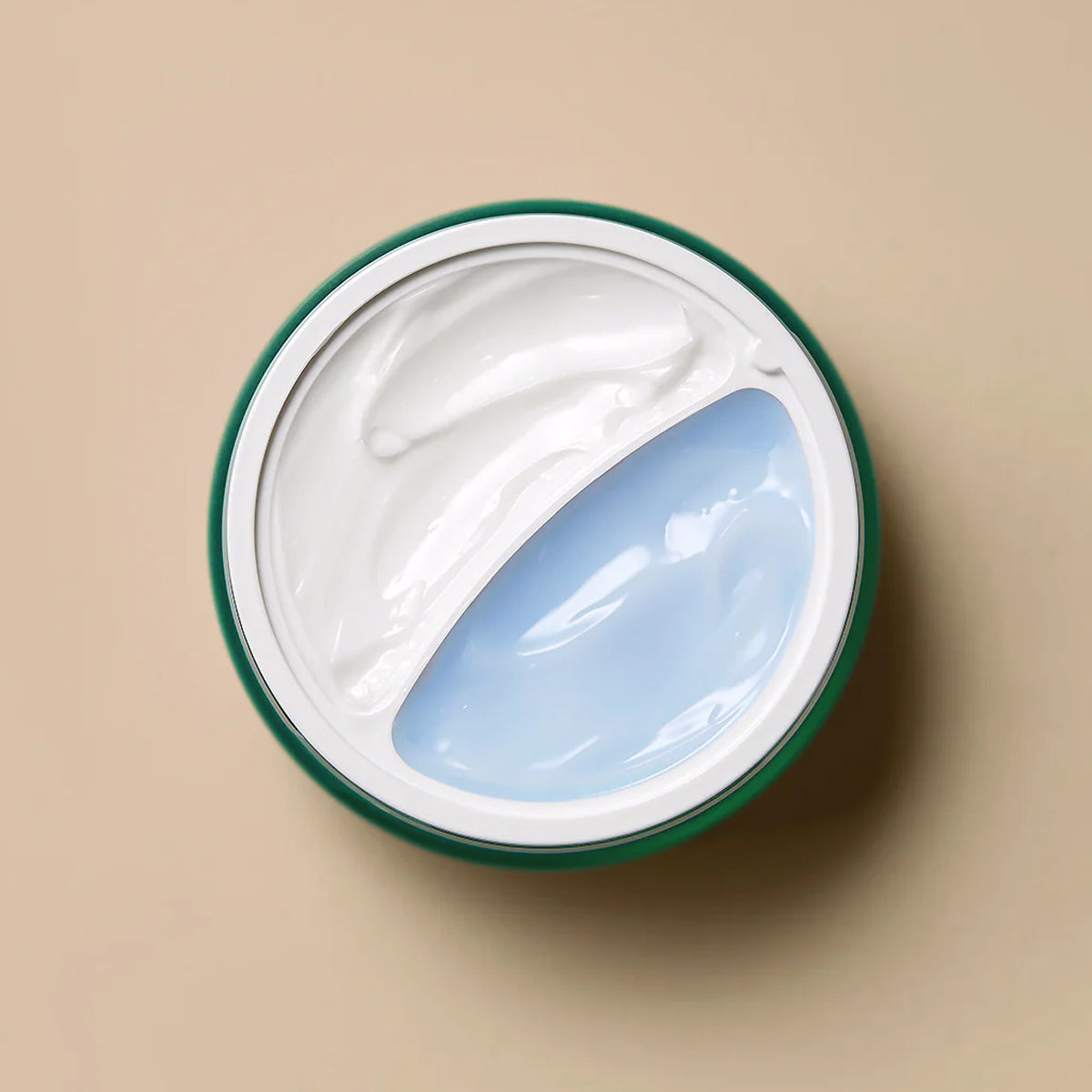 Jar of cream with a green lid on a beige background