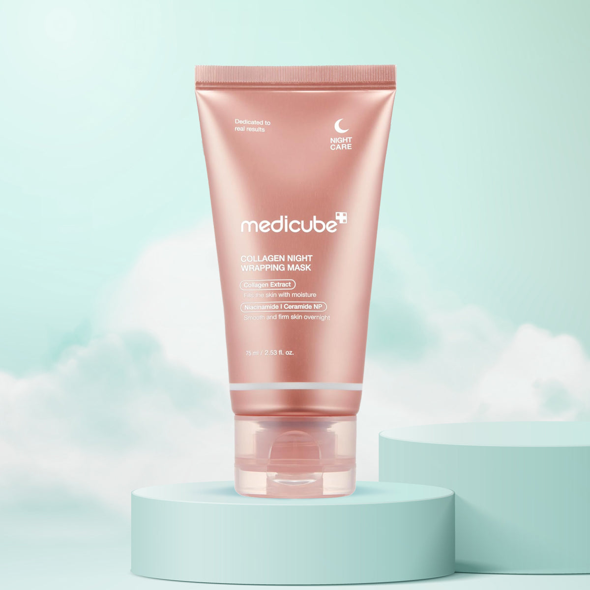 A pink tube of Medicube Collagen Night Wrapping Mask placed on a cylindrical pedestal with a bright blue background, resembling a natural and soft aesthetic.