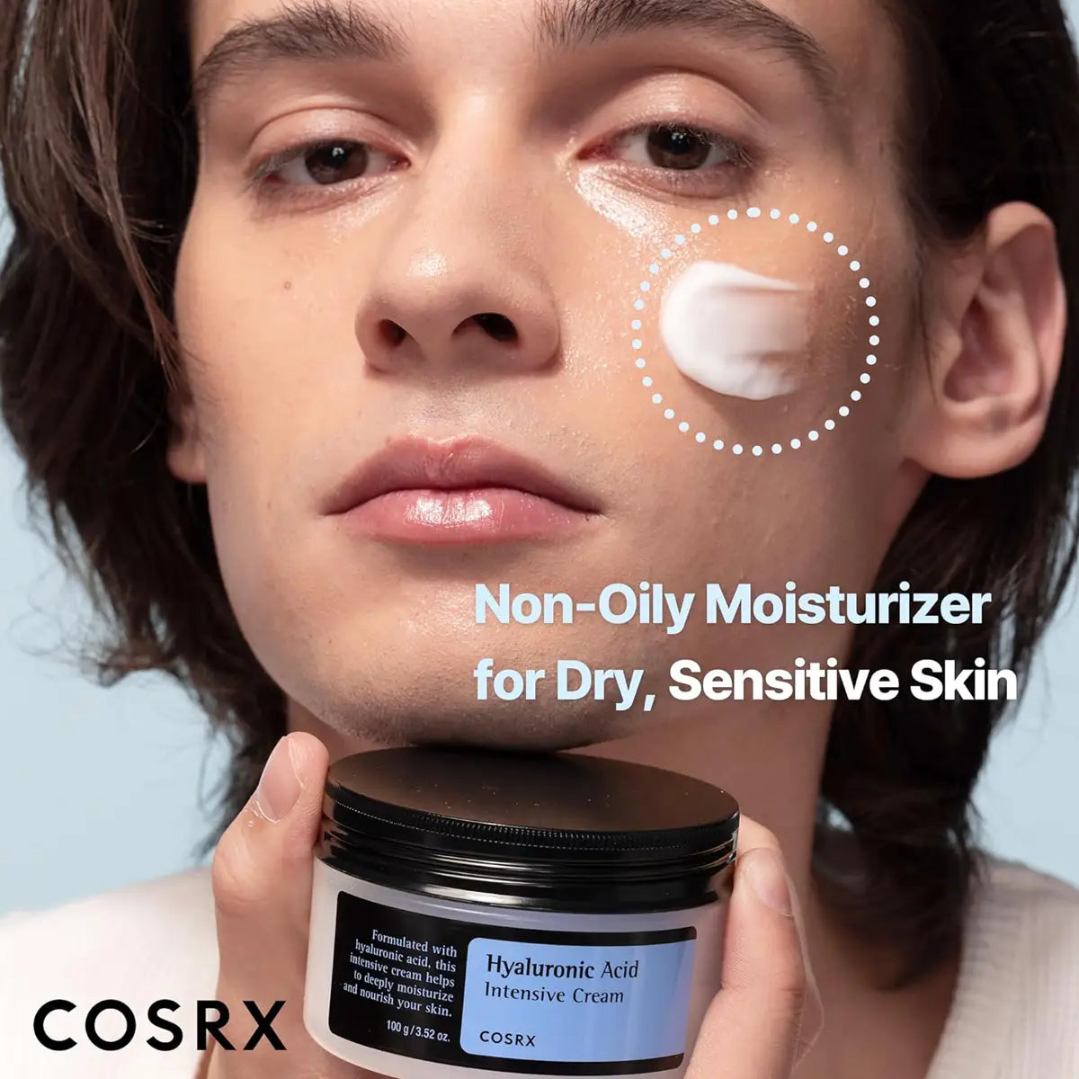 Person holding a jar of COSRX moisturizer with product application on face
