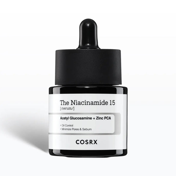 Cosrx The Niacinamide 15 Serum bottle with dropper on a white background