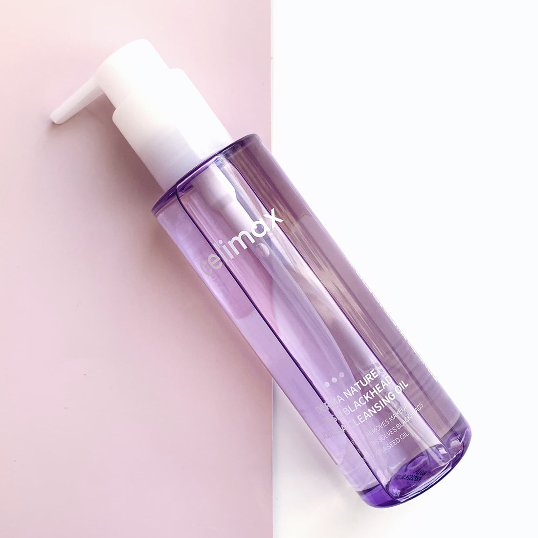 Purple bottle with white cap on a light pink background