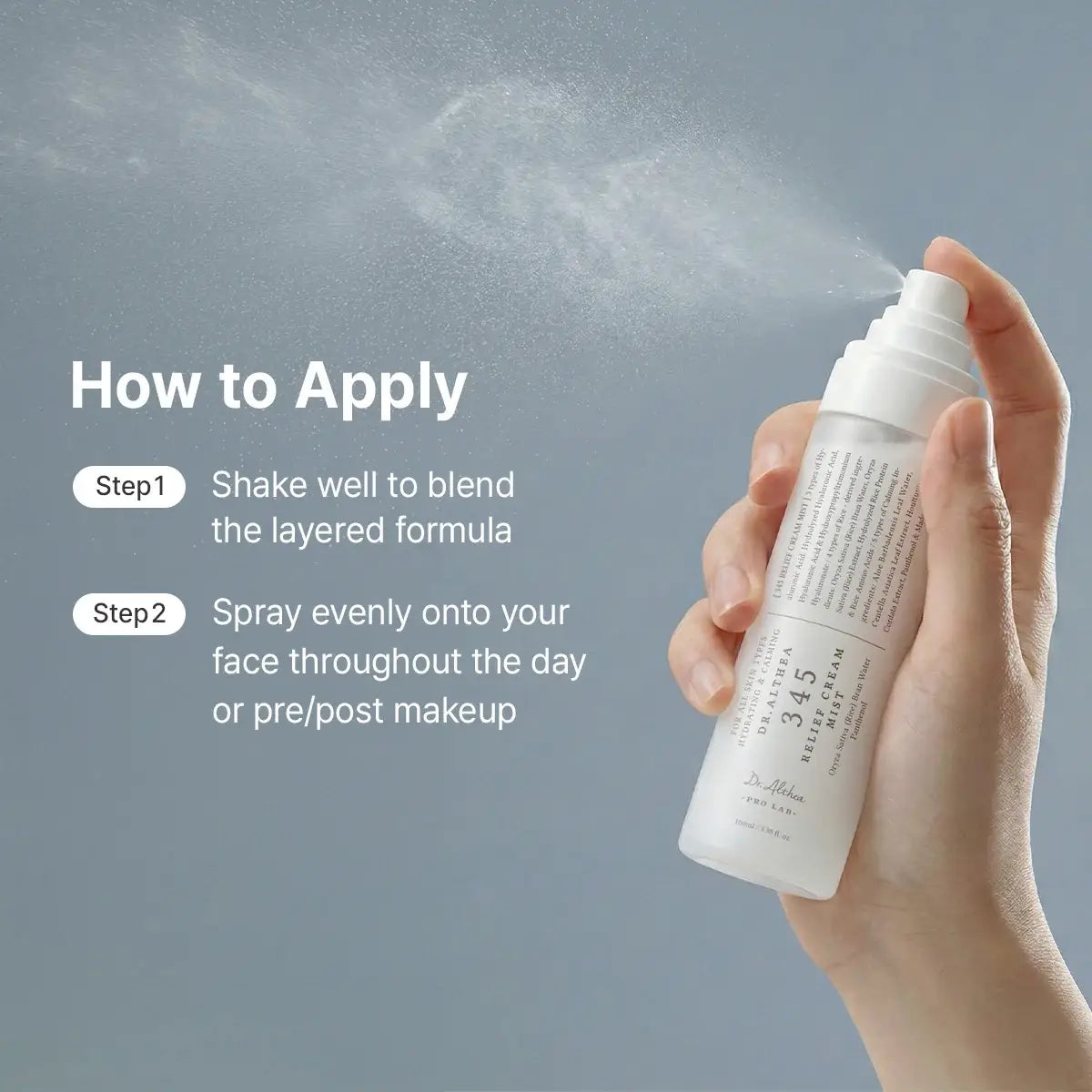 Hand holding a spray bottle with application instructions on a gray background