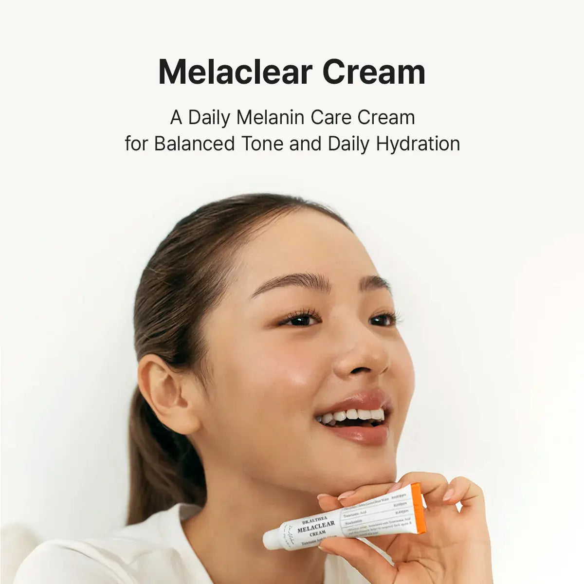 Dr. Althea Melaclear Cream, a daily melanin care cream for balanced tone and hydration, applied by a smiling woman.
