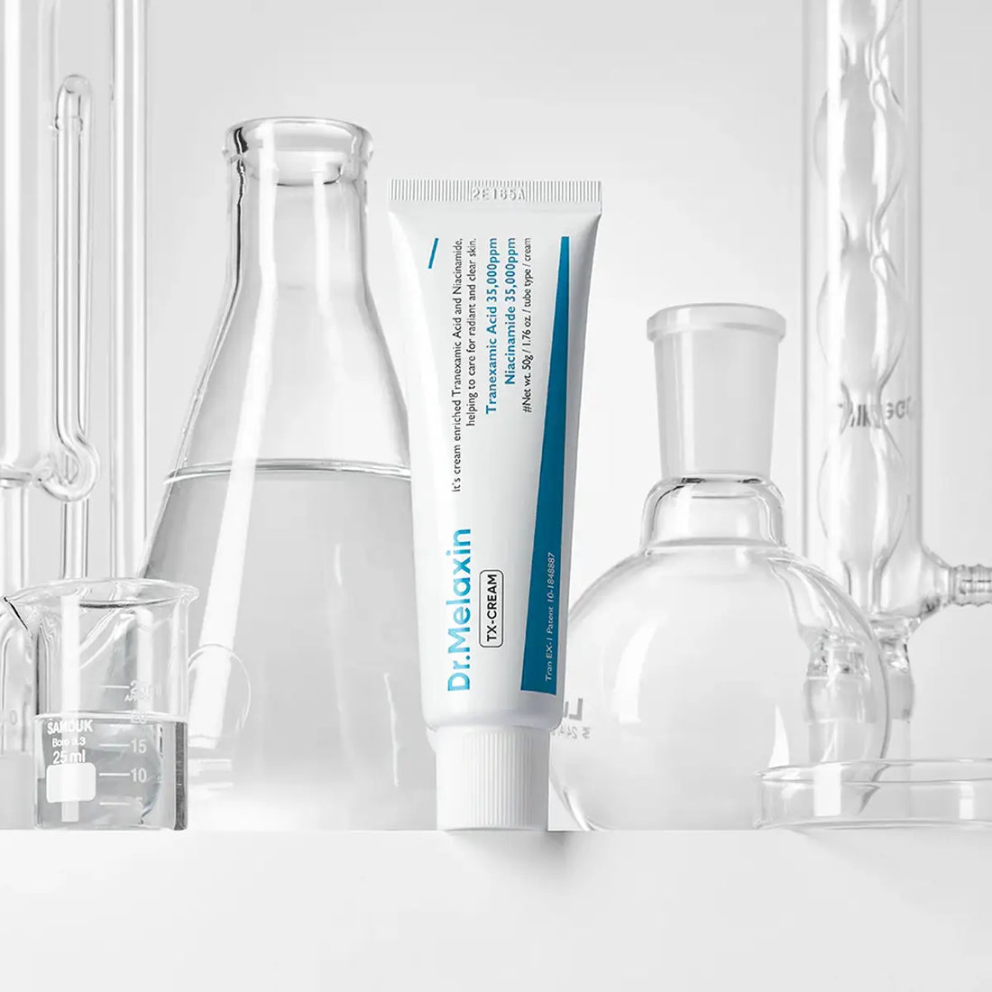 Tube of Dr. Melaxin cream with laboratory equipment in the background