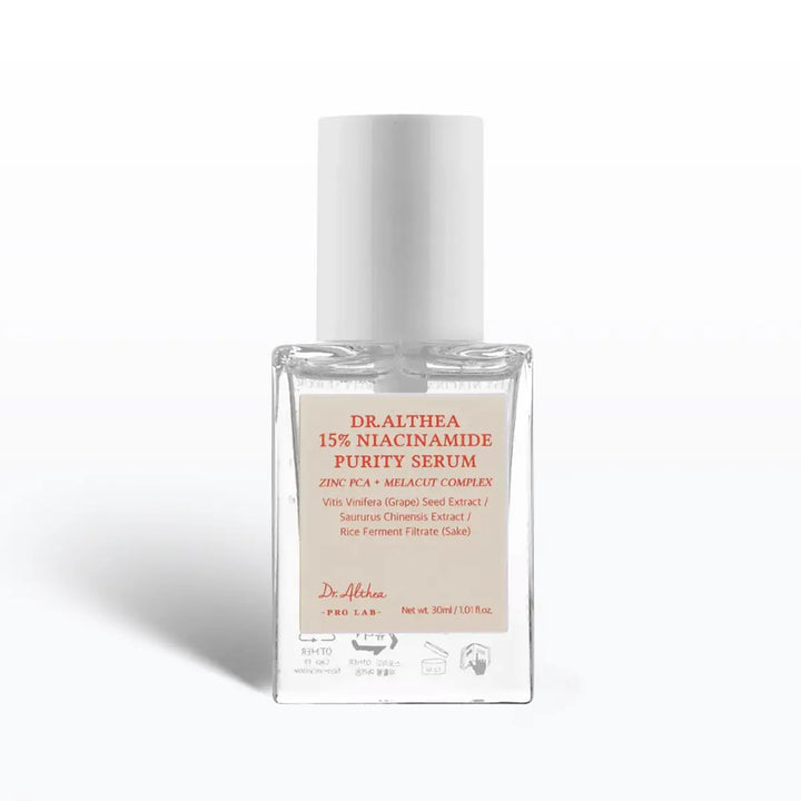 Serum bottle with white cap and beige label on a white background
