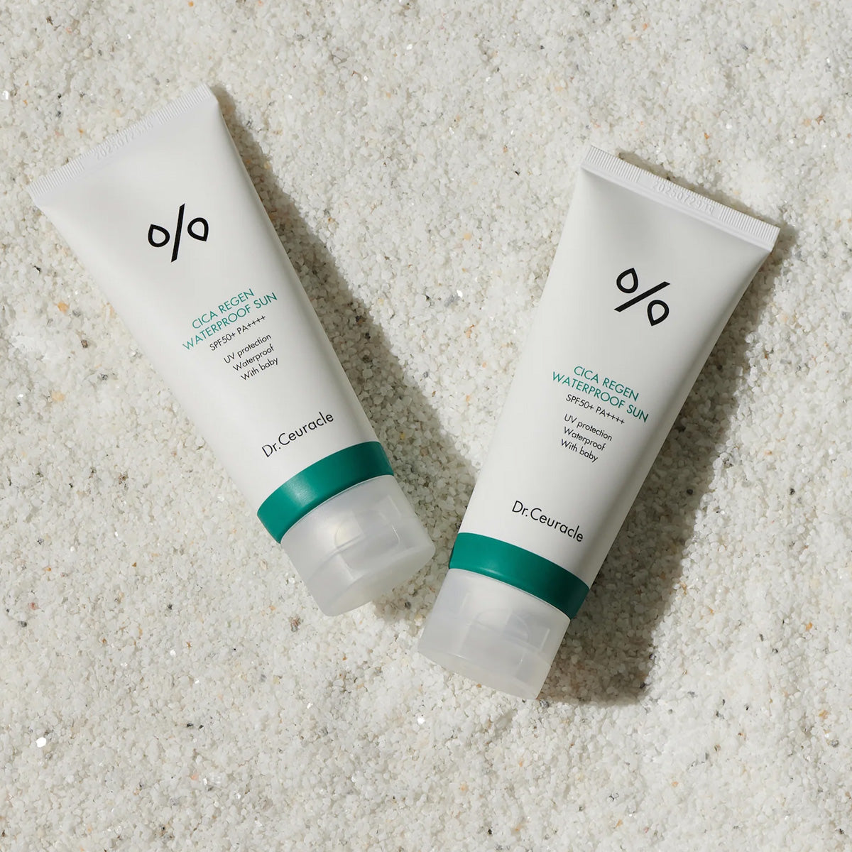 Two Dr. Ceuracle skincare products on a textured beige surface