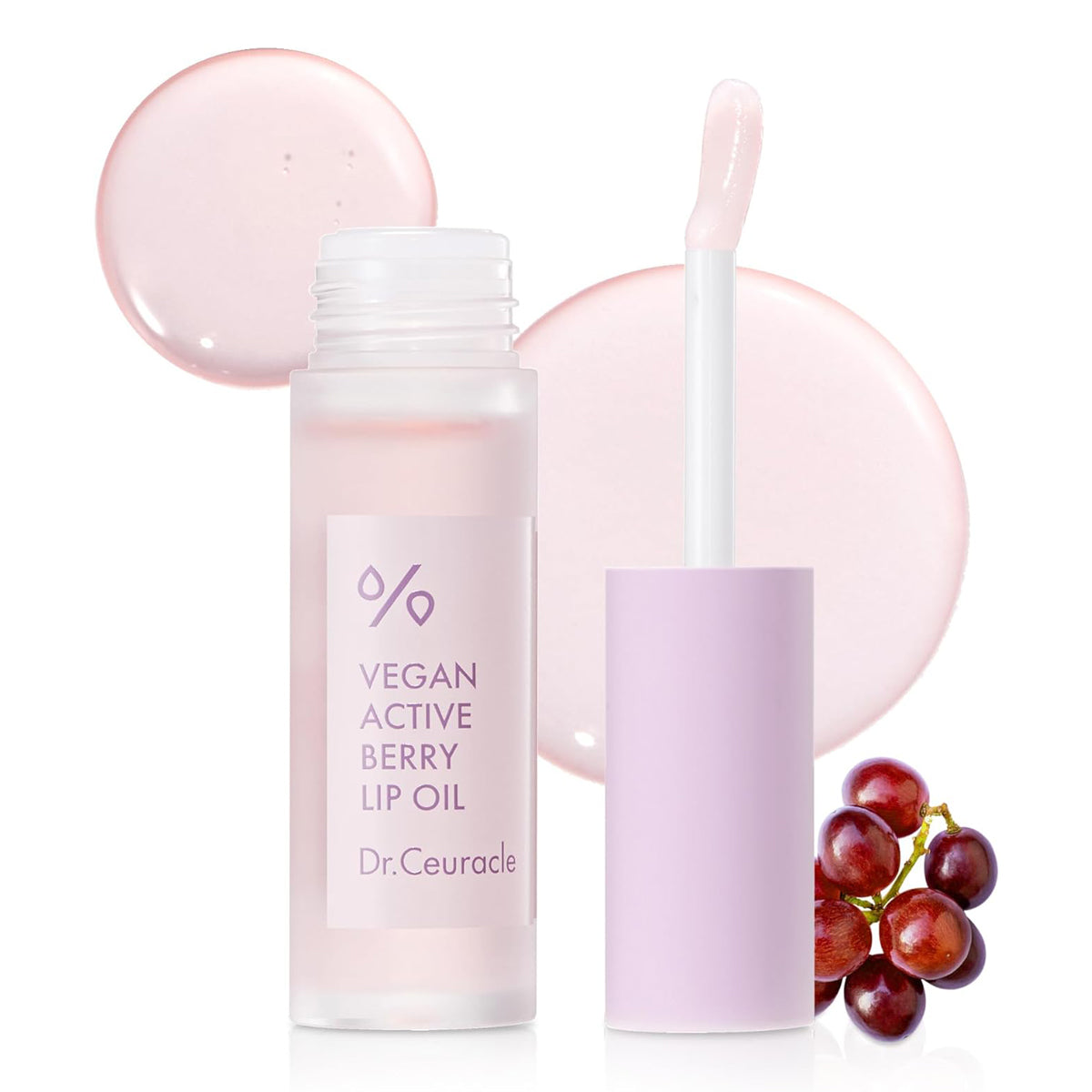 Dr. Ceuracle Vegan Active Berry Lip Oil with a dropper and grapes on a white background