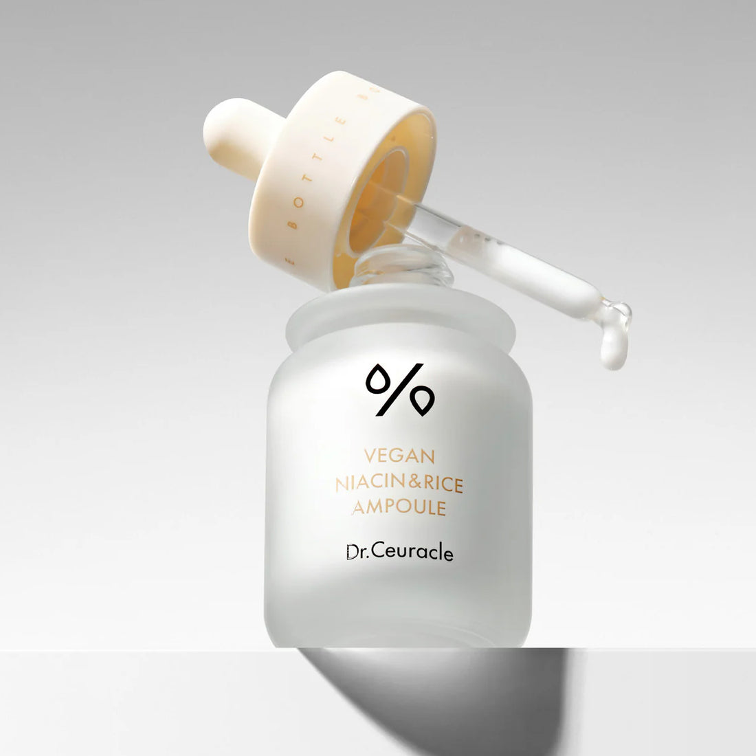 Dr. Ceuracle skincare ampoule bottle with dropper on a light gray background