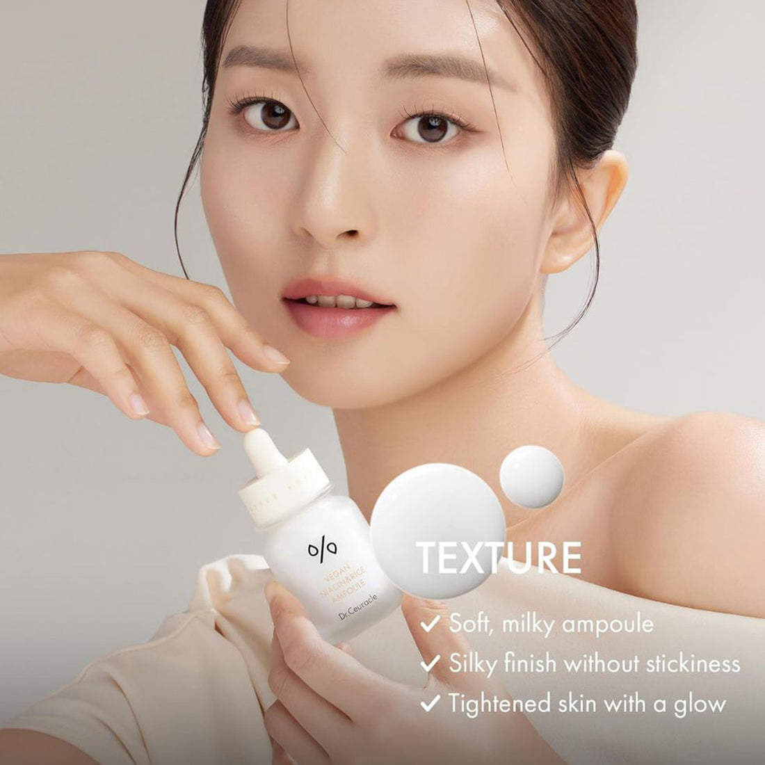 Woman holding a skincare product with text about texture on a neutral background