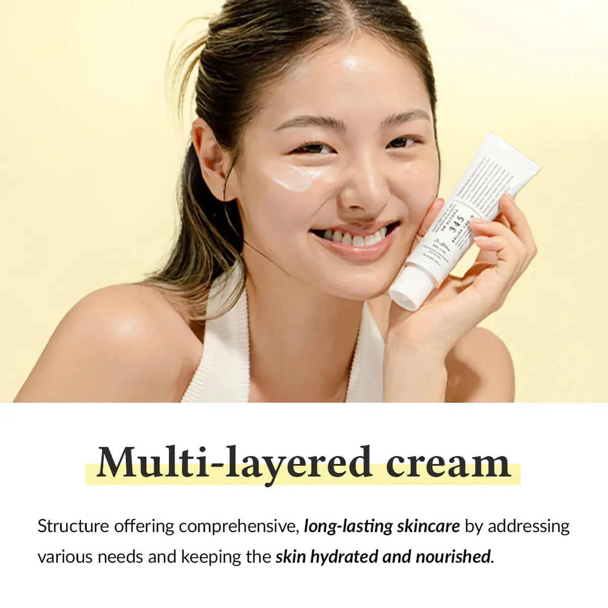 Woman holding a tube of cream with text about multi-layered skincare on a beige background