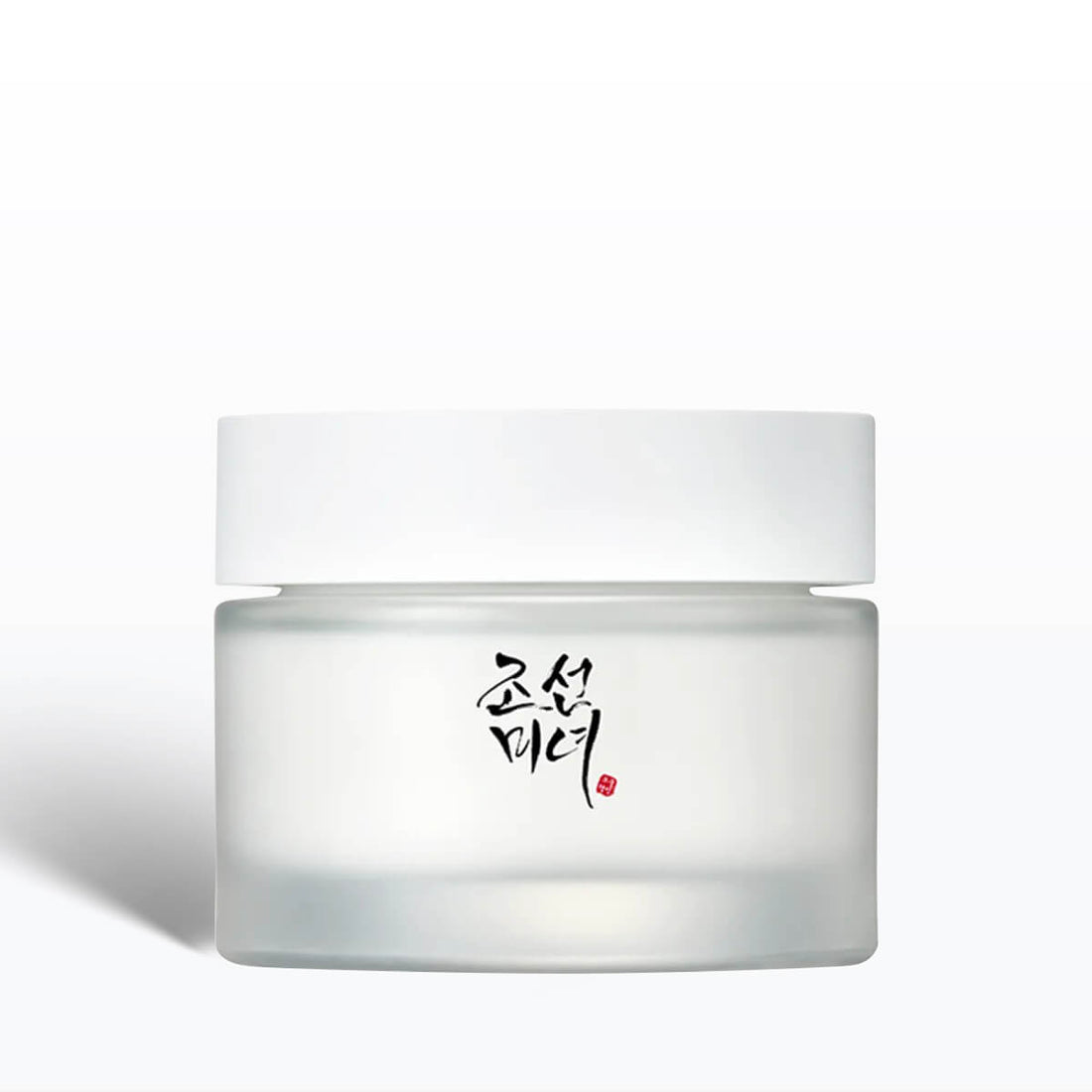 White jar of cream with black text on a white background