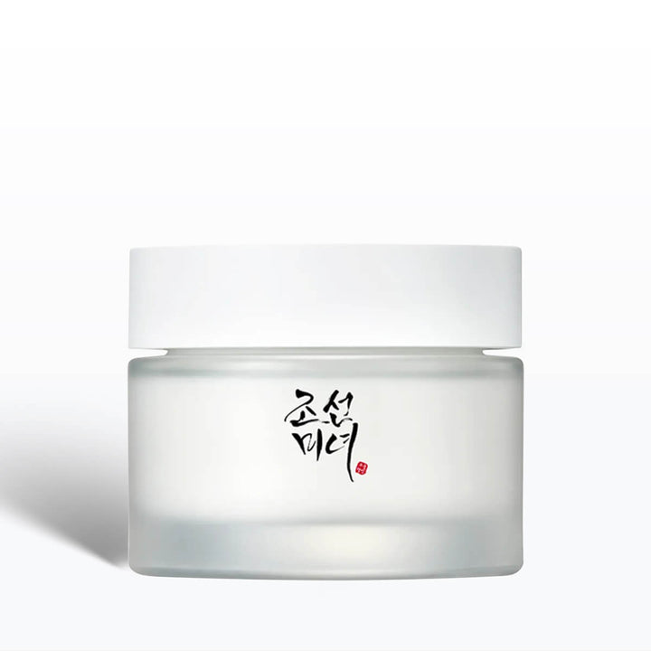 White jar of cream with black text on a white background