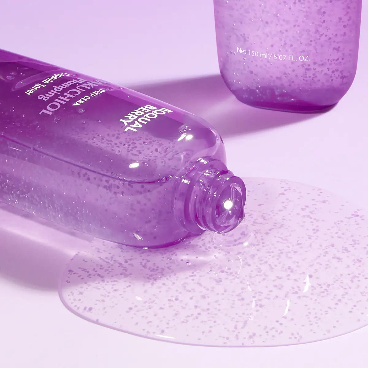 Eqqualberry Bakuchiol Plumping Capsule Toner bottles with visible branding on a light purple background