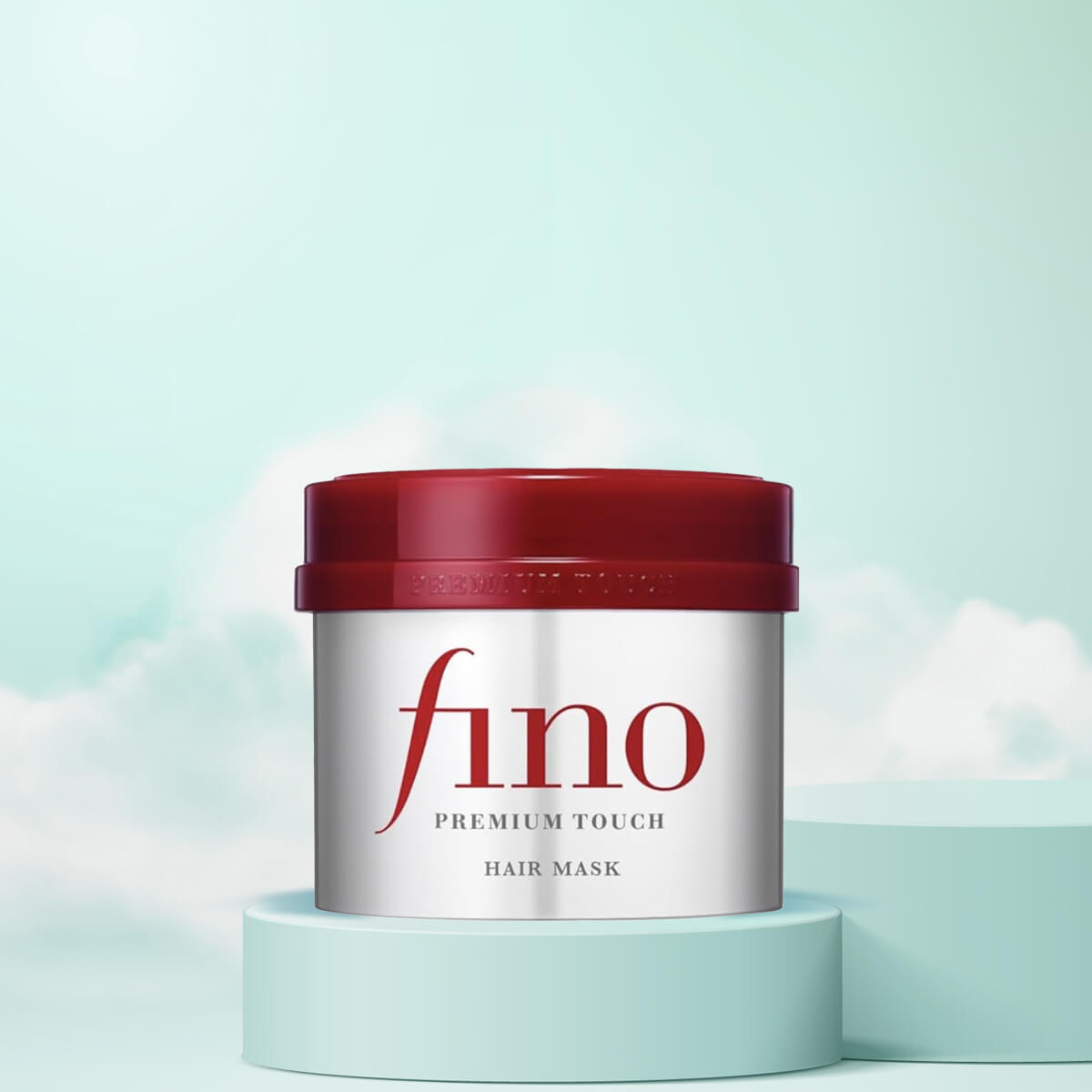 Fino Premium Touch hair mask jar with red lid on a light blue background
