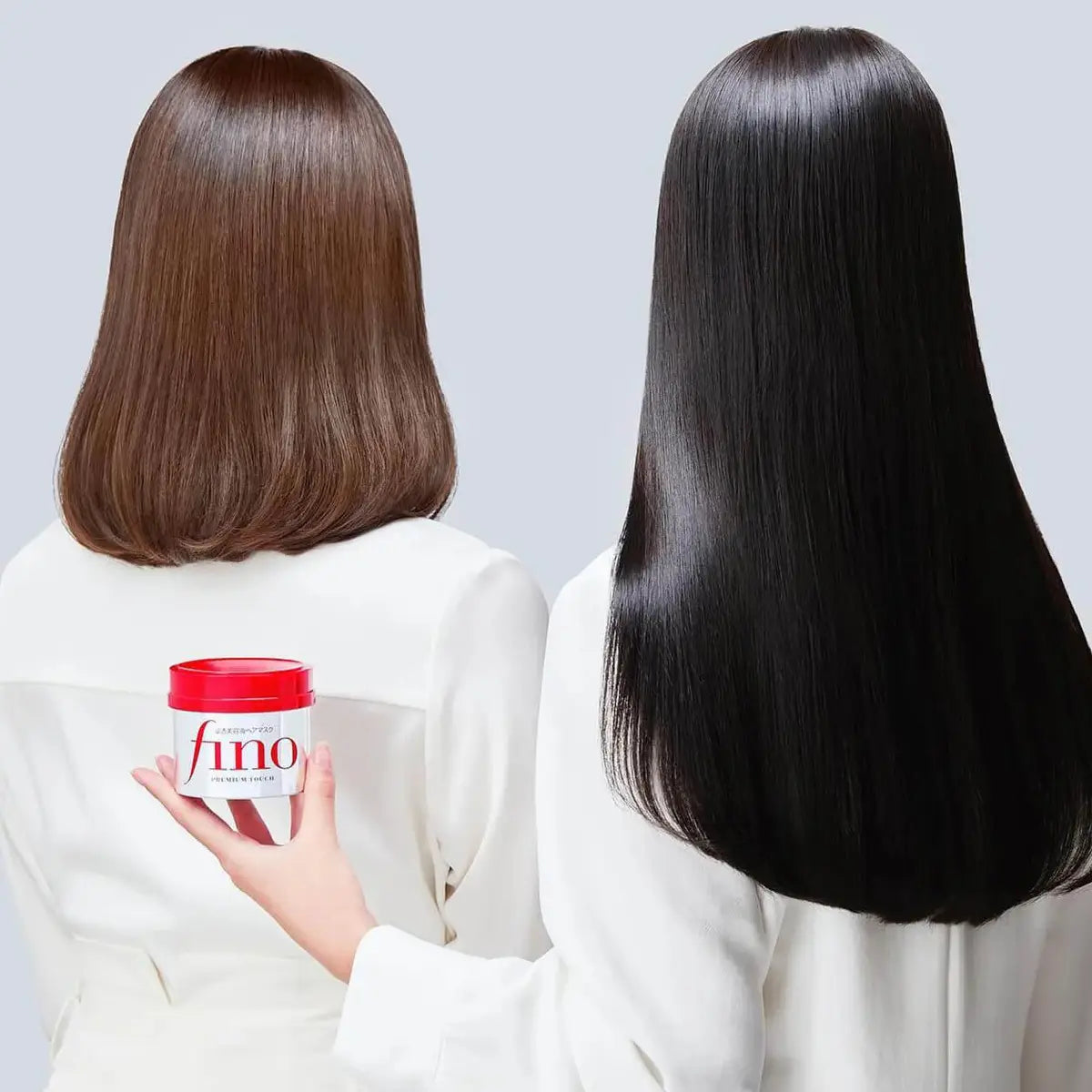 Two women with different hair colors holding a Fino product container against a light gray background