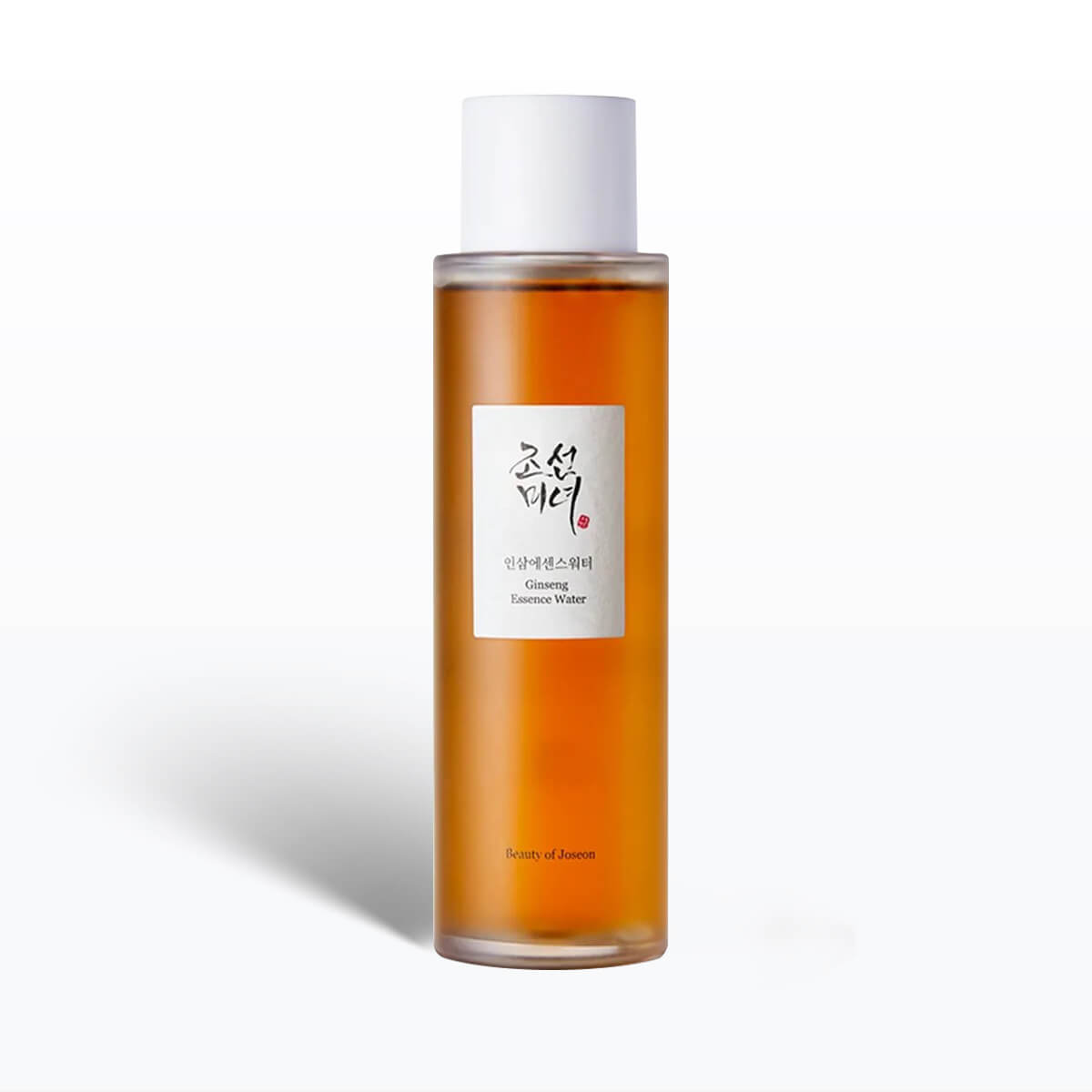 Skincare bottle with a white cap and orange liquid on a white background