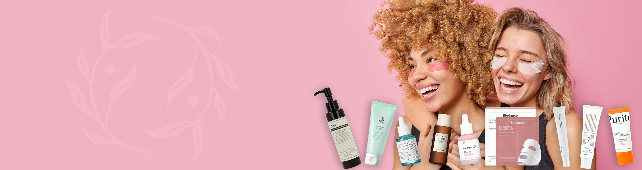 Two women with skincare products on a pink background