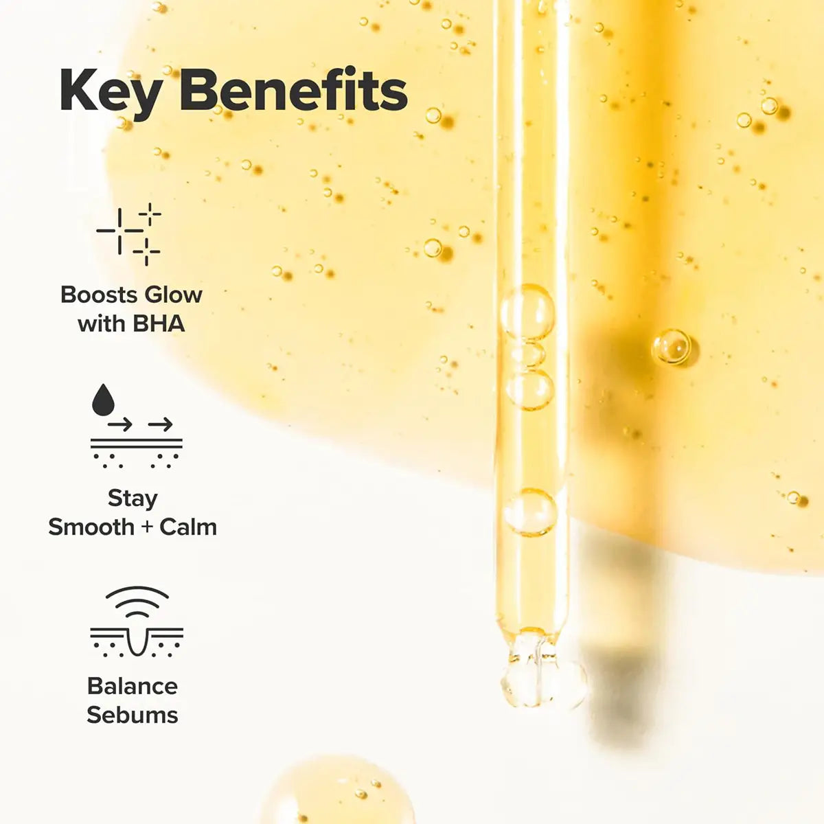 Skincare serum dropper with key benefits text on a white background